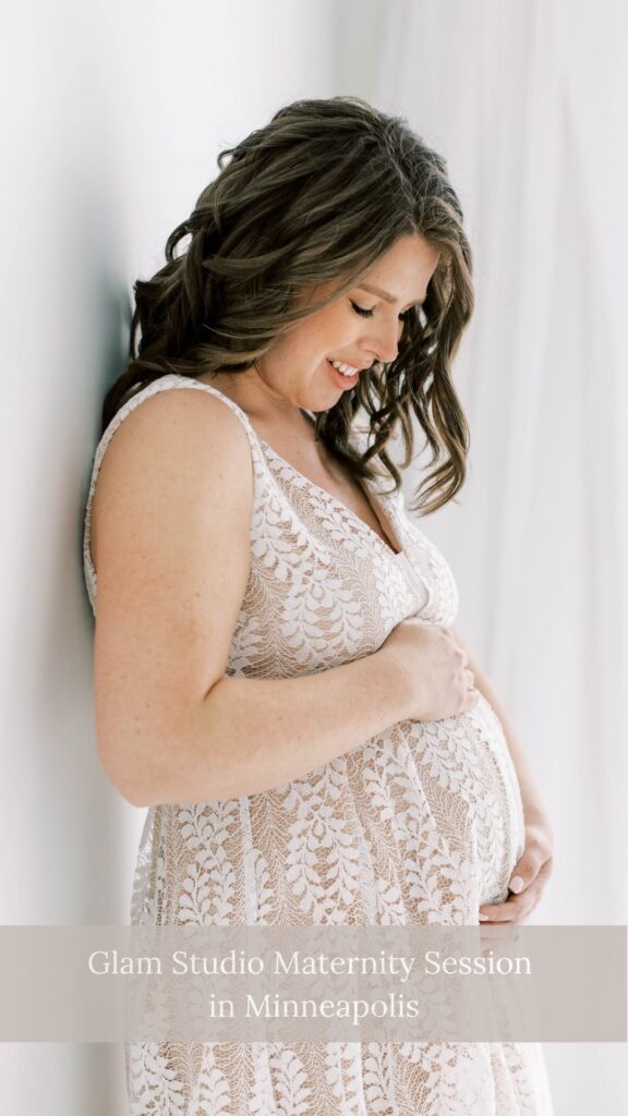 mother holding baby bump at glam maternity session